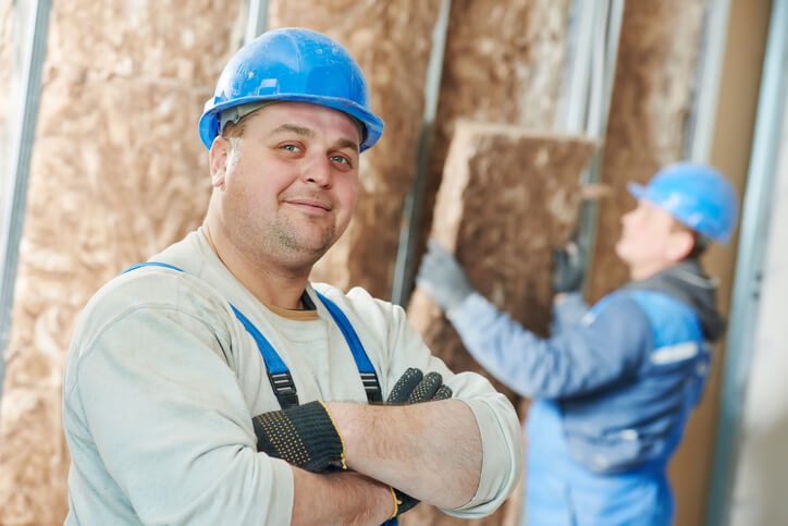 California Contractor License Defense - Construction worker at insulation work