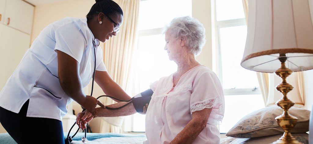 Nurse checking blood pressure of female patient - California nurse dui