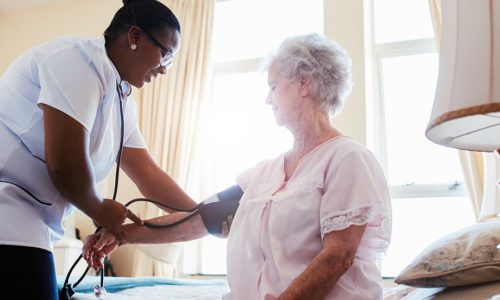 Nurse checking blood pressure of female patient - California nurse dui